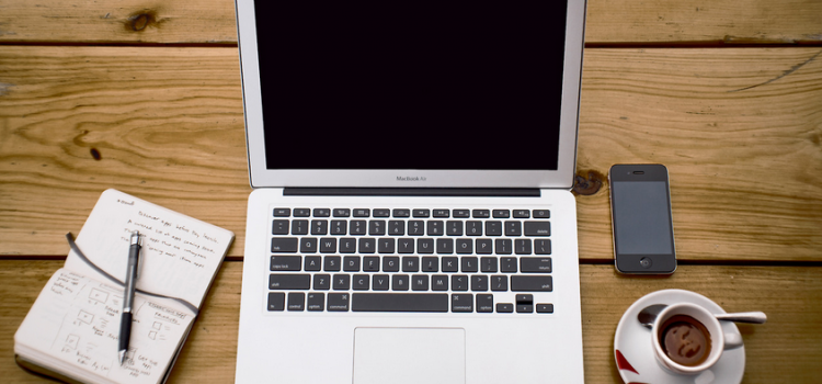 laptop Mac Book Air and a cup of Coffee